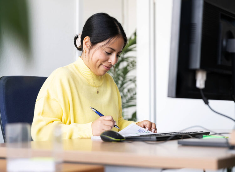 STAR employee scheduling appointments, sitting at the desk.