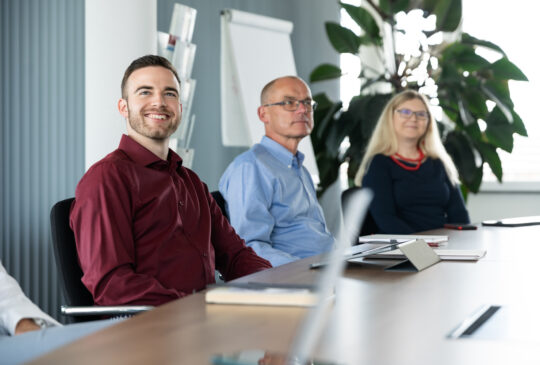 Three STAR team members sitting at a conference table.